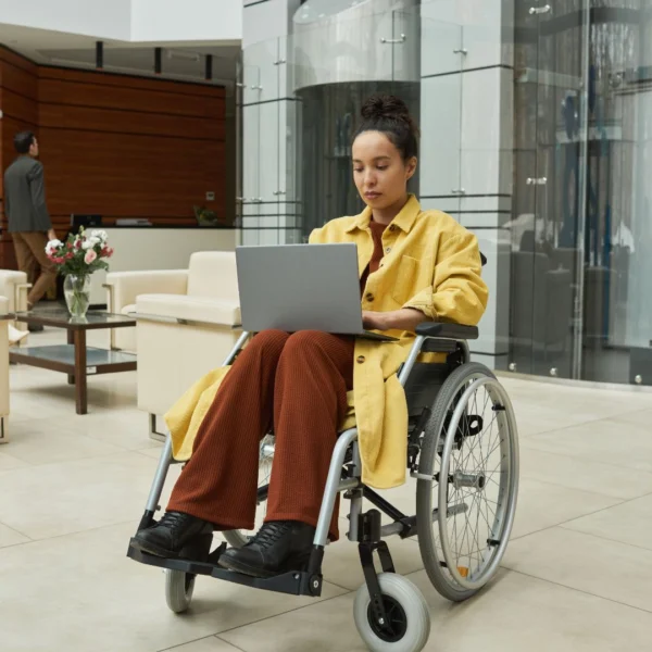 woman in wheelchair with a laptop