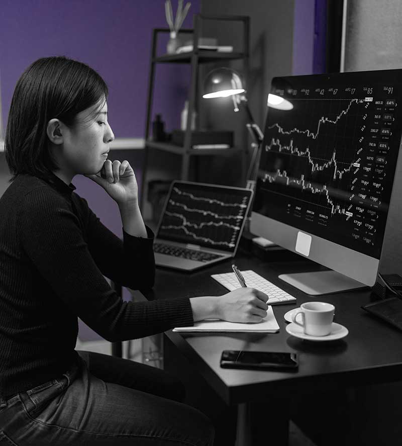 woman checking investments on computer