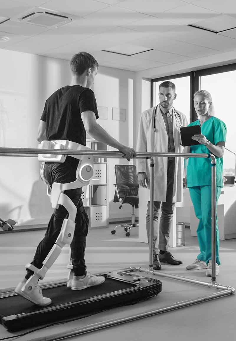 man doing exercise with robotic assisted leg braces