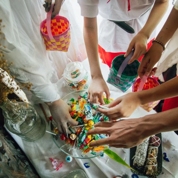 kids taking Halloween candy from a bowl